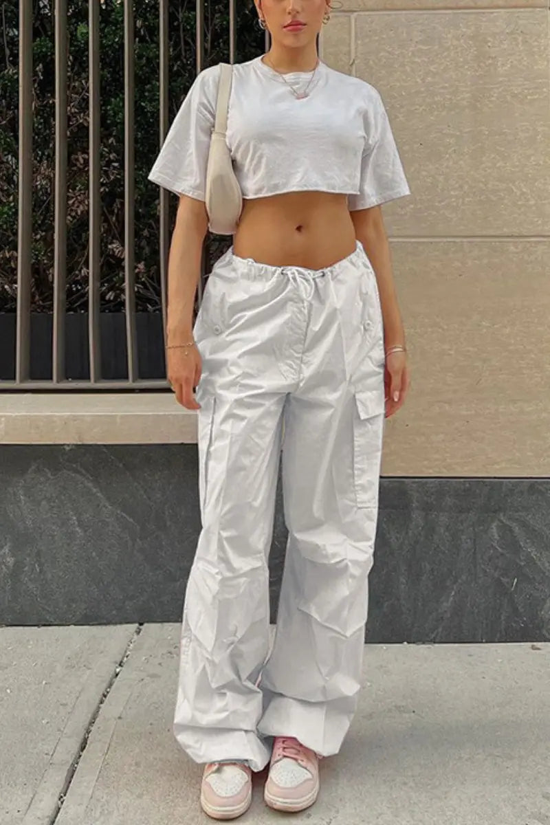 Most Requested Kylie Jenner Poses in White One Shoulder Crop Top the  Attico Cargo Jeans and Alexander Wang Denim Pumps